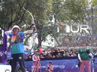 Deepika Kumari of India and Alejandra Valencia of Mexico compete during the women's recurve semifinals match on the final day of the Tlaxcal...