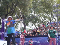 Deepika Kumari of India and Alejandra Valencia of Mexico compete during the women's recurve semifinals match on the final day of the Tlaxcal...