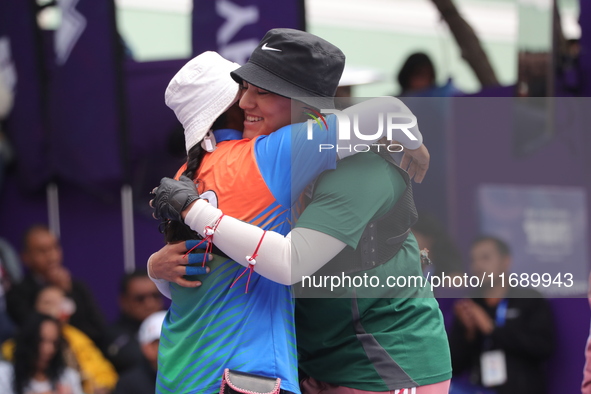 Deepika Kumari of India and Alejandra Valencia of Mexico compete during the women's recurve semifinals match on the final day of the Tlaxcal...