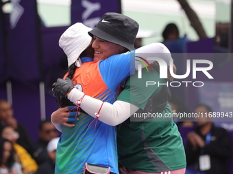 Deepika Kumari of India and Alejandra Valencia of Mexico compete during the women's recurve semifinals match on the final day of the Tlaxcal...