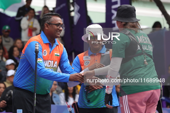 Deepika Kumari of India and Alejandra Valencia of Mexico compete during the women's recurve semifinals match on the final day of the Tlaxcal...