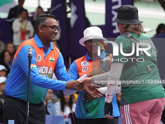 Deepika Kumari of India and Alejandra Valencia of Mexico compete during the women's recurve semifinals match on the final day of the Tlaxcal...