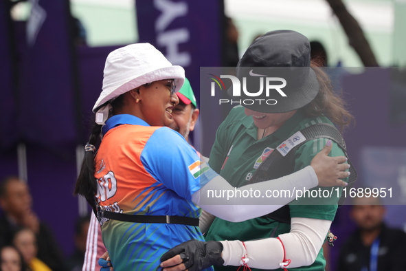 Deepika Kumari of India and Alejandra Valencia of Mexico compete during the women's recurve semifinals match on the final day of the Tlaxcal...