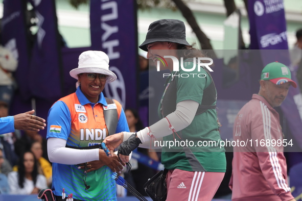 Deepika Kumari of India and Alejandra Valencia of Mexico compete during the women's recurve semifinals match on the final day of the Tlaxcal...