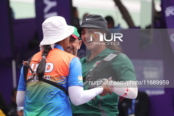 Deepika Kumari of India and Alejandra Valencia of Mexico compete during the women's recurve semifinals match on the final day of the Tlaxcal...