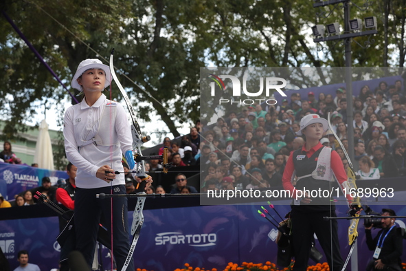 Li Jiaman of China and Jeon Hunyoung of Korea compete during the women's recurve semifinals match on the final day of the Tlaxcala 2024 Arch...