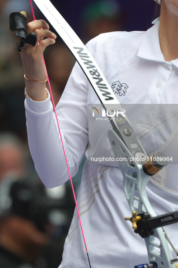 Jeon Hunyoung of Korea competes against Li Jiaman of China (not in picture) during the women's recurve semifinals match on the final day of...