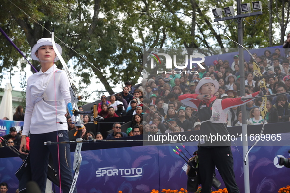 Li Jiaman of China and Jeon Hunyoung of Korea compete during the women's recurve semifinals match on the final day of the Tlaxcala 2024 Arch...