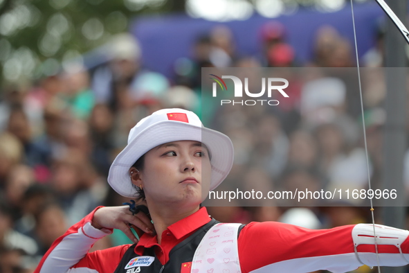 Li Jiaman of China competes against Jeon Hunyoung of Korea (not in picture) during the women's recurve semifinals match on the final day of...