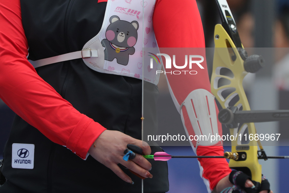 Li Jiaman of China competes against Jeon Hunyoung of Korea (not in picture) during the women's recurve semifinals match on the final day of...