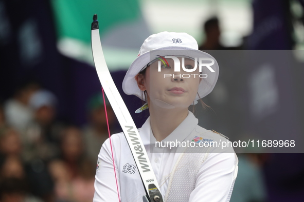 Jeon Hunyoung of Korea competes against Li Jiaman of China (not in picture) during the women's recurve semifinals match on the final day of...