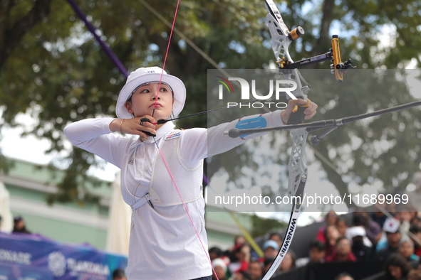 Jeon Hunyoung of Korea competes against Li Jiaman of China (not in picture) during the women's recurve semifinals match on the final day of...