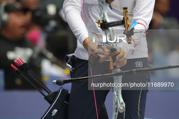 Jeon Hunyoung of Korea competes against Li Jiaman of China (not in picture) during the women's recurve semifinals match on the final day of...