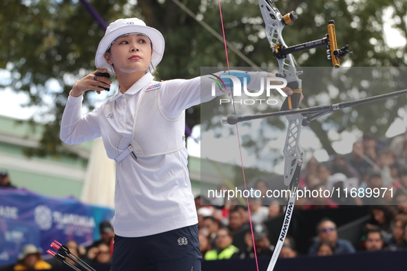 Jeon Hunyoung of Korea competes against Li Jiaman of China (not in picture) during the women's recurve semifinals match on the final day of...