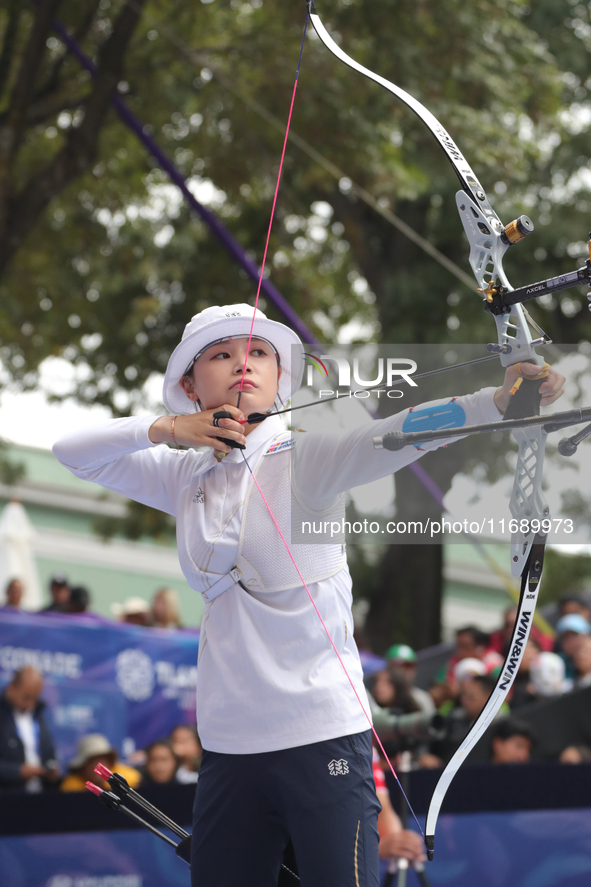 Jeon Hunyoung of Korea competes against Li Jiaman of China (not in picture) during the women's recurve semifinals match on the final day of...