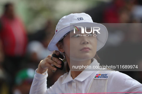 Jeon Hunyoung of Korea competes against Li Jiaman of China (not in picture) during the women's recurve semifinals match on the final day of...