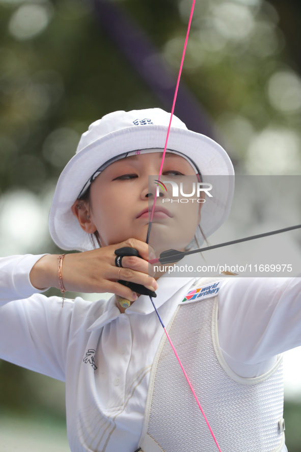 Jeon Hunyoung of Korea competes against Li Jiaman of China (not in picture) during the women's recurve semifinals match on the final day of...