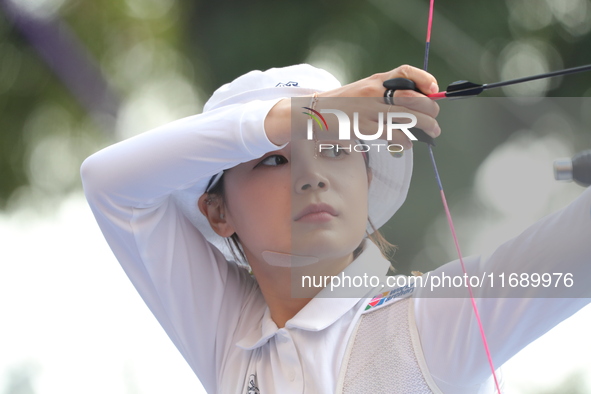 Jeon Hunyoung of Korea competes against Li Jiaman of China (not in picture) during the women's recurve semifinals match on the final day of...