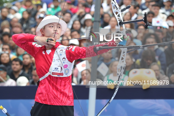 Li Jiaman of China competes against Jeon Hunyoung of Korea (not in picture) during the women's recurve semifinals match on the final day of...