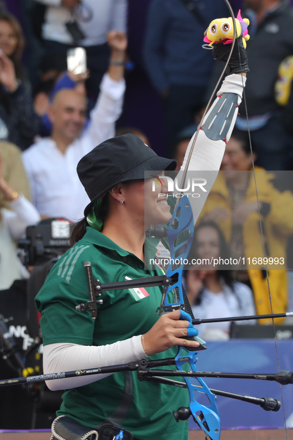 Alejandra Valencia of Mexico competes against Jeon Hunyoung of Korea (not in picture) during the women's recurve 3rd place match on the fina...