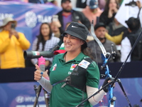 Alejandra Valencia of Mexico competes against Jeon Hunyoung of Korea (not in picture) during the women's recurve 3rd place match on the fina...