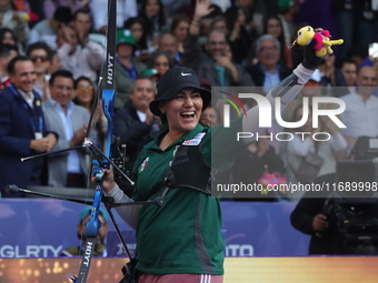 Alejandra Valencia of Mexico competes against Jeon Hunyoung of Korea (not in picture) during the women's recurve 3rd place match on the fina...