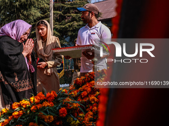 Family members of police martyrs pay tribute to the soldiers who sacrifice their lives in service during Police Commemoration Day in Baramul...