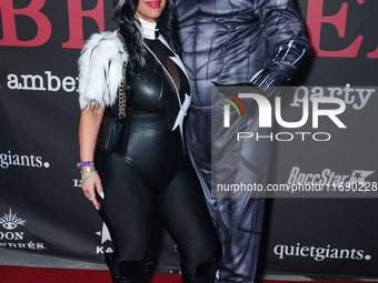 Jannine Vecchil and Gerard Smalls arrive at Amberween - An Amber Rose Birthday Party held at a Private Residence on October 19, 2024 in Tarz...