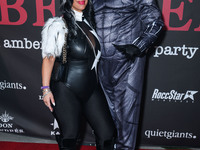 Jannine Vecchil and Gerard Smalls arrive at Amberween - An Amber Rose Birthday Party held at a Private Residence on October 19, 2024 in Tarz...