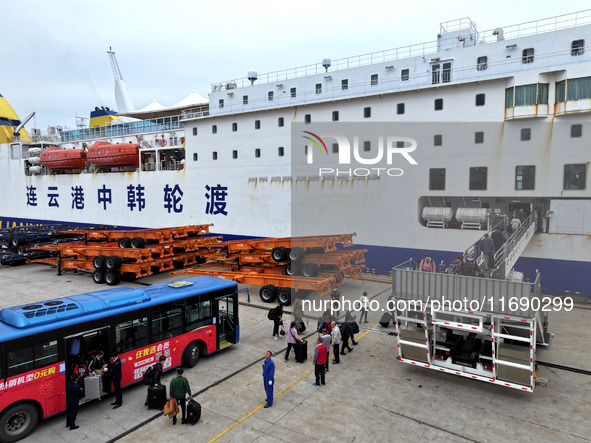 Passengers board a ferry after customs clearance at Lianyungang International Passenger Station in Lianyungang, China, on October 21, 2024....