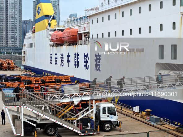 Passengers board a ferry after customs clearance at Lianyungang International Passenger Station in Lianyungang, China, on October 21, 2024....