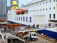 Passengers board a ferry after customs clearance at Lianyungang International Passenger Station in Lianyungang, China, on October 21, 2024....