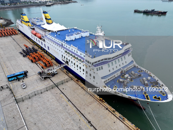 Passengers board a ferry after customs clearance at Lianyungang International Passenger Station in Lianyungang, China, on October 21, 2024....