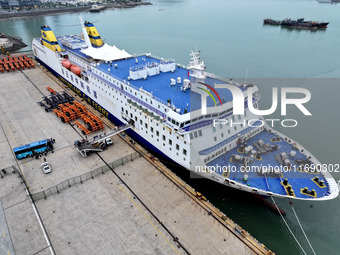 Passengers board a ferry after customs clearance at Lianyungang International Passenger Station in Lianyungang, China, on October 21, 2024....