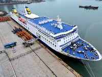 Passengers board a ferry after customs clearance at Lianyungang International Passenger Station in Lianyungang, China, on October 21, 2024....