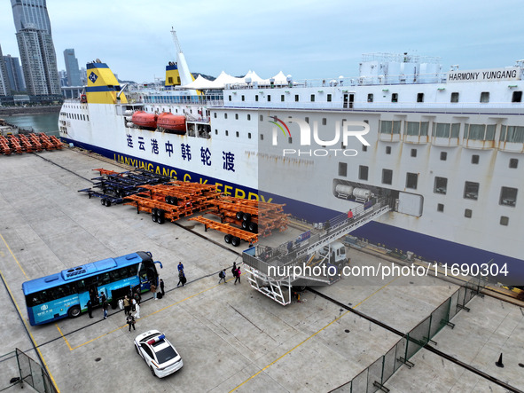 Passengers board a ferry after customs clearance at Lianyungang International Passenger Station in Lianyungang, China, on October 21, 2024....