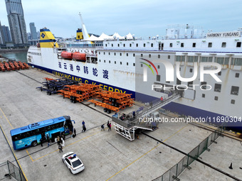 Passengers board a ferry after customs clearance at Lianyungang International Passenger Station in Lianyungang, China, on October 21, 2024....