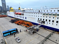 Passengers board a ferry after customs clearance at Lianyungang International Passenger Station in Lianyungang, China, on October 21, 2024....