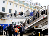 Passengers board a ferry after customs clearance at Lianyungang International Passenger Station in Lianyungang, China, on October 21, 2024....