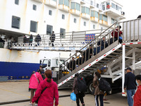 Passengers board a ferry after customs clearance at Lianyungang International Passenger Station in Lianyungang, China, on October 21, 2024....