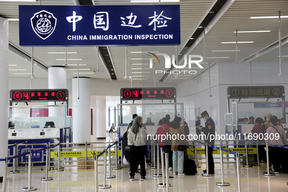 Passengers board a ferry after customs clearance at Lianyungang International Passenger Station in Lianyungang, China, on October 21, 2024....