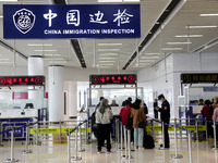 Passengers board a ferry after customs clearance at Lianyungang International Passenger Station in Lianyungang, China, on October 21, 2024....