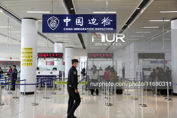 Passengers board a ferry after customs clearance at Lianyungang International Passenger Station in Lianyungang, China, on October 21, 2024....