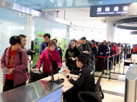 Passengers board a ferry after customs clearance at Lianyungang International Passenger Station in Lianyungang, China, on October 21, 2024....