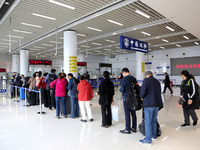 Passengers board a ferry after customs clearance at Lianyungang International Passenger Station in Lianyungang, China, on October 21, 2024....