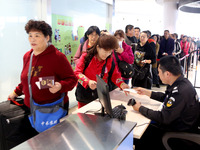 Passengers board a ferry after customs clearance at Lianyungang International Passenger Station in Lianyungang, China, on October 21, 2024....