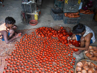 Workers apply final touches to clay oil lamps, which are made for sale ahead of the Diwali festival celebration in Kolkata, India, on Octobe...