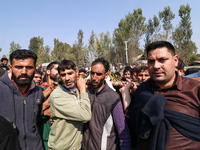 People carry the dead body of a doctor who is killed in an alleged militant attack in the Nadigam area of Budgam district, Indian-administer...