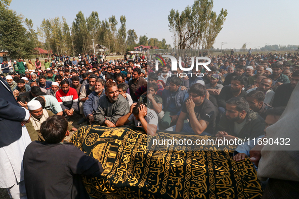 People wail during the funeral of a doctor who is killed in an alleged militant attack in the Nadigam area of Budgam district, Indian-admini...