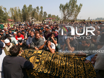 People wail during the funeral of a doctor who is killed in an alleged militant attack in the Nadigam area of Budgam district, Indian-admini...